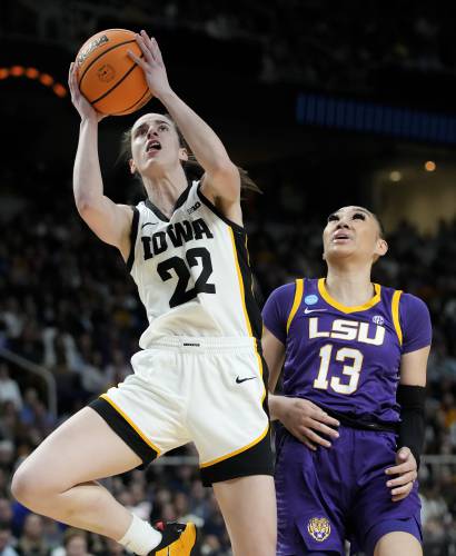 Iowa guard Caitlin Clark (22) puts up a shot against LSU guard Last-Tear Poa (13) during the first quarter of an Elite Eight round college basketball game during the NCAA Tournament, Monday, April 1, 2024, in Albany, N.Y. (AP Photo/Mary Altaffer)