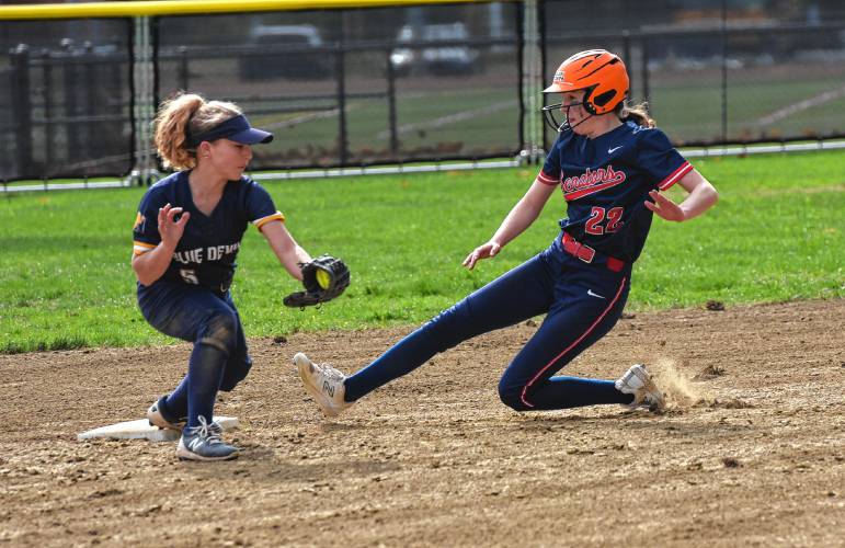 Mahar’s Avery Savage (22), right, slides safely into second base ahead of the tag from Northampton shortstop Haly Doucette Kaplan (5) during Franklin County League East action on Monday in Orange.