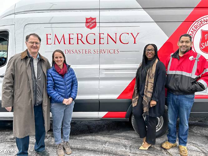 This year, seven volunteers with the Salvation Army Athol Corps were at the 128th Boston Marathon to provide food and drinks. Pictured left to right are philanthropist Dan Flatley and Salvation Army volunteers and coordinators.