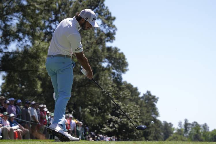 Max Homa hits his tee shot on the ninth hole during second round at the Masters golf tournament at Augusta National Golf Club Friday, April 12, 2024, in Augusta, Ga. (AP Photo/Charlie Riedel)