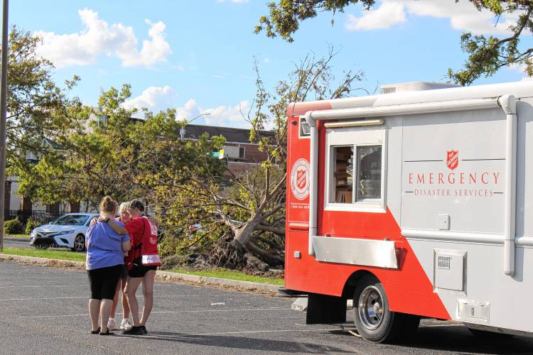 Pam Houghton and Cindy Kennedy speak with a resident of Douglas, Georgia, during their deployment to help with the response to Hurricane Helene.