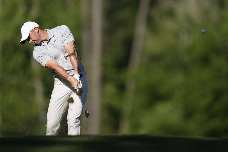 Rory McIlroy, of Northern Ireland, hits his tee shot on the 12th hole during second round at the Masters golf tournament at Augusta National Golf Club Friday, April 12, 2024, in Augusta, Ga. (AP Photo/Charlie Riedel)