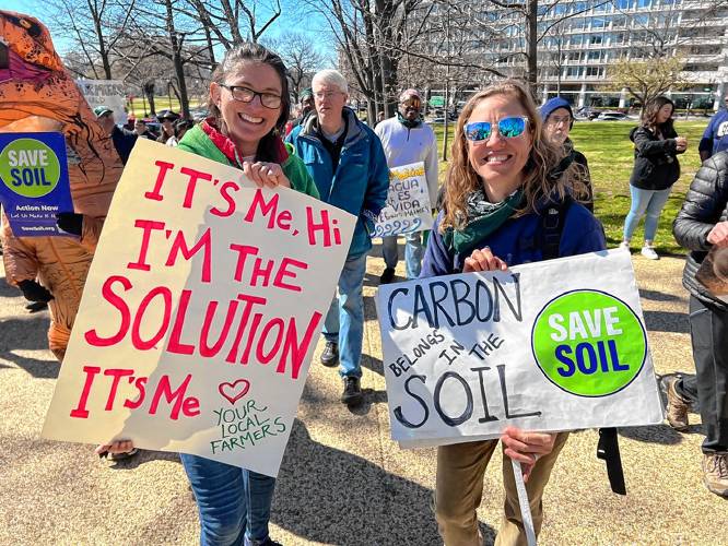 Sarah Voiland marches with a new friend, Janet Aardema, of Broadfork Farm in Virginia, during a Farmers for Climate Action rally in Washington, D.C., organized by the National Sustainable Agriculture Coalition.