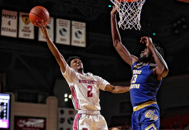 UMass’ Jaylen Curry (2) puts up a shot against George Washington during the Minutemen’s 81-67 victory on Saturday at the Mullins Center in Amherst.