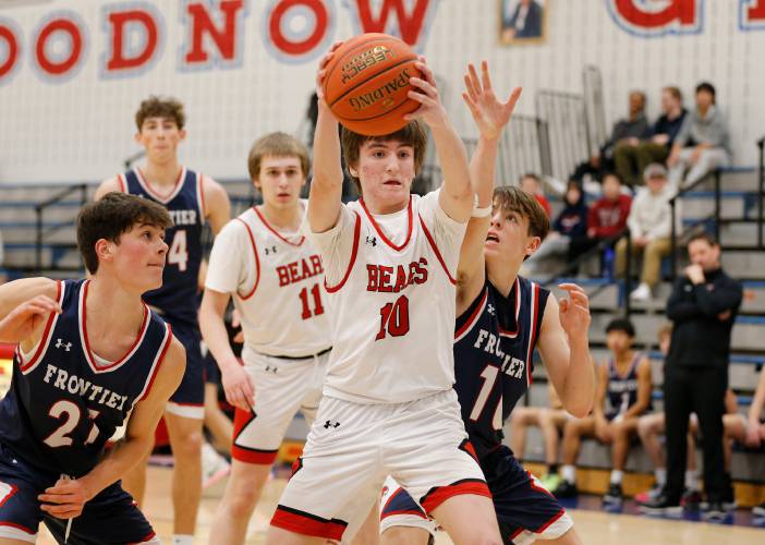 Athol’s Ben Kearney (10) pulls down a rebound against Frontier in the third quarter Thursday at Goodnow Gymnasium in South Deerfield.