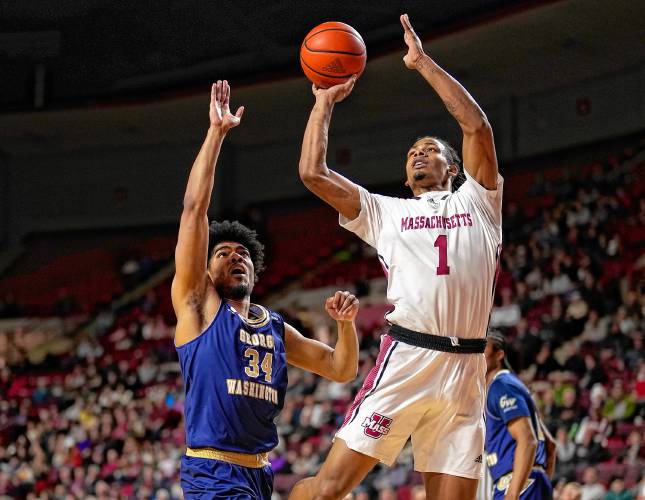 UMass’ Daniel Hankins-Sanford (1) puts up a shot against George Washington during the Minutemen’s 81-67 victory on Saturday at the Mullins Center in Amherst.