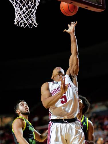 UMass guard Keon Thompson (5) puts in a breakaway layup against South Florida in the second half Saturday at the Mullins Center in Amherst.