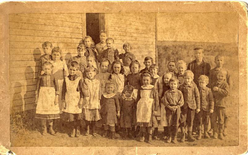 Students stand outside the Wendell Center School in 1890 with their teacher Alice Taylor Brown. This photo is among those that can be viewed at the Wendell Historical Society’s new online museum.