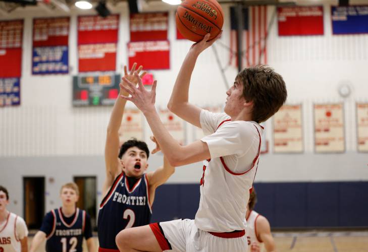Athol’s Ben Kearney (10) takes a shot from the baseline against Frontier in the second quarter Thursday at Goodnow Gymnasium in South Deerfield.