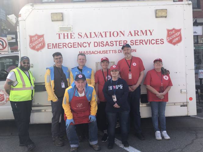 Several Salvation Army Athol Corps volunteers helped provide drinks and snacks at Monday's Boston Marathon. Pictured here (second from right) is Athol Salvation Army Coordinator Dan Parsons.   