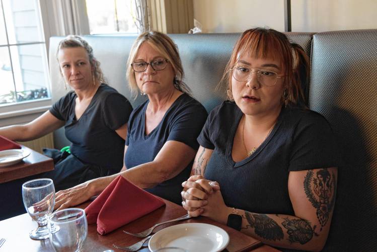  Akasia McQuaid talks about why she and the other servers at Eastside Grill in Northampton feel strongly about voting no on Question 5 on Election Day. The ballot initiative seeks to raise the minimum hourly wage for tipped workers until it equals that of all Massachusetts workers. To the left are Jill Slattery and Diane Frary. 
