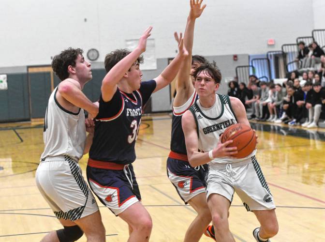 Greenfield’s Jacob Blanchard runs into traffic against Frontier during Hampshire League South action at Nichols Gymnasium in Greenfield on Tuesday evening.