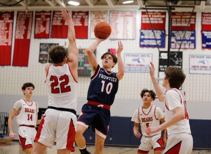 Frontier’s Max Millette (10) shoots in the lane over Athol defender Ray Castine (22) in the first quarter Thursday at Goodnow Gymnasium in South Deerfield.
