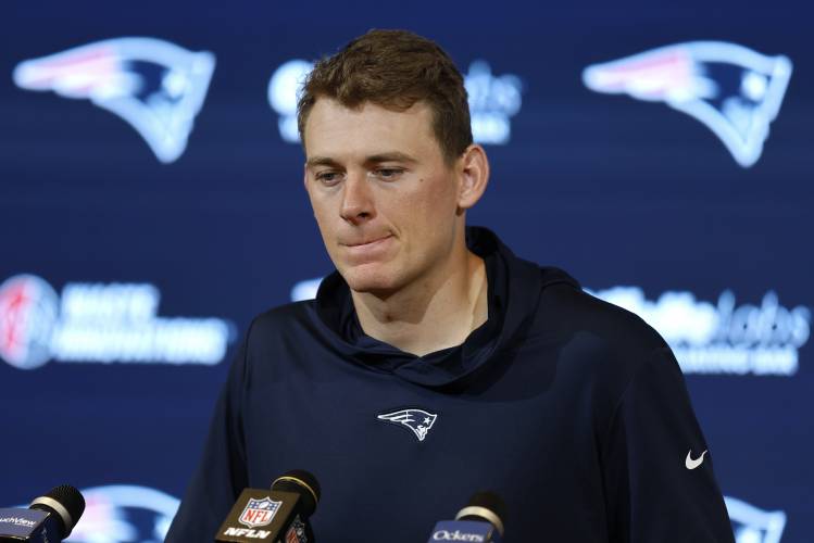 New England Patriots quarterback Mac Jones faces reporters following the team's loss to the Washington Commanders in an NFL football game, Sunday, Nov. 5, 2023, in Foxborough, Mass. (AP Photo/Michael Dwyer)