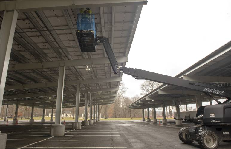 A canopy solar parking lot off University Drive at UMass. Experts at the fourth and final Western Massachusetts Solar Forum two weeks ago agreed that solar energy is a key way the state can meet its climate goals, but had differing opinions on the best way to develop those projects, whether it be on farmland, forest land, or on the build environments like parking lots and rooftops.