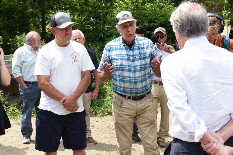Farmers Bernie Smiarowski of Hatfield and Joe Czajkowski of Hadley talk with U.S. Sen. Ed Markey at the flood-damaged fields at Natural Roots farm in Conway in early August. Natural Roots was recently awarded $10,000 through the Farm Resiliency Fund.