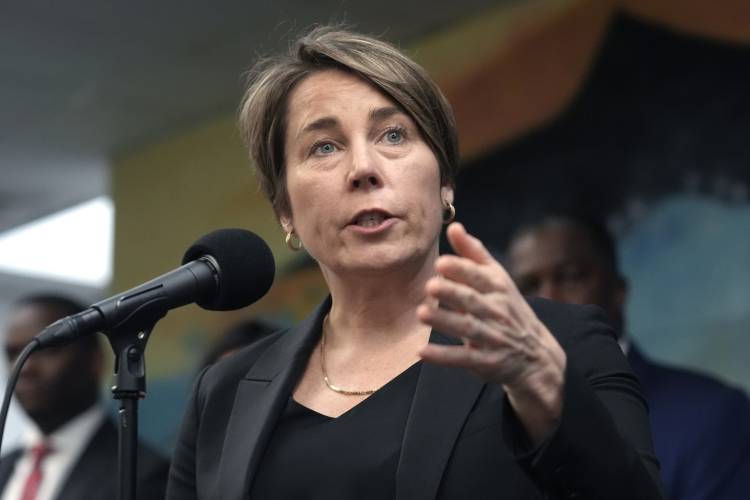 Massachusetts Gov. Maura Healey takes questions from reporters Wednesday, Jan. 31, 2024, after touring the Cass Recreational Complex, in the Roxbury neighborhood of Boston. The visit to the facility was held ahead of its planned opening as a temporary shelter site for families experiencing homelessness as the state continues to grapple with an influx of homeless migrants. (AP Photo/Steven Senne)