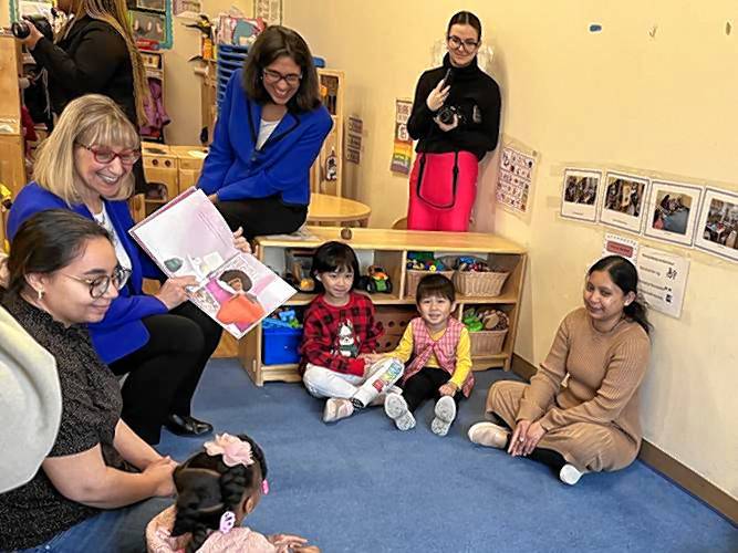 Senate President Karen Spilka reads a book to children at a Head Start center in Malden. 