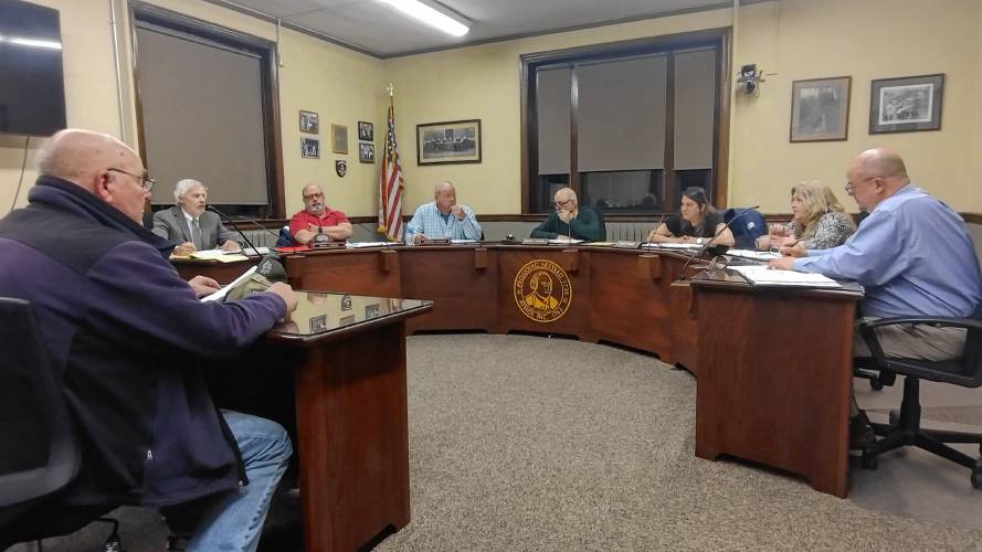 Athol resident and business owner Dennis Whelpley (far left) urges the Selectboard to take action to accelerate the cleanup of property at 1756 Main St., which was destroyed by fire last August. 