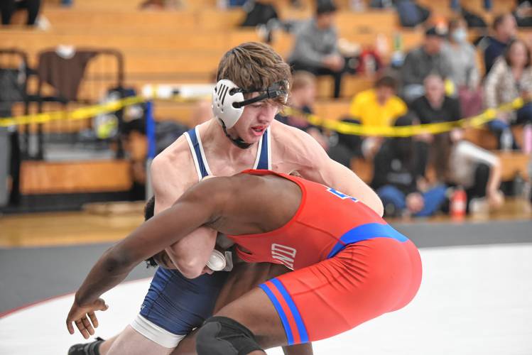Mahar's Sayyid Roberts takes down Ashland’s Kevin Ozulumba at the MIAA Div. 3 Central Mass. Championship at Ashland High School on Saturday.  
