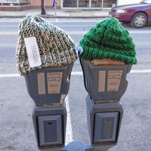 Knit hats adorn a couple parking meters on Main Street in Athol following last January’s “scarf bombing” event.