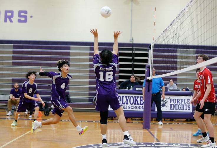 Holyoke’s Michael Melendez (16) sets the ball up for Adrian Centeno-Feliciano (4) in the first set against Athol on Friday in Holyoke.